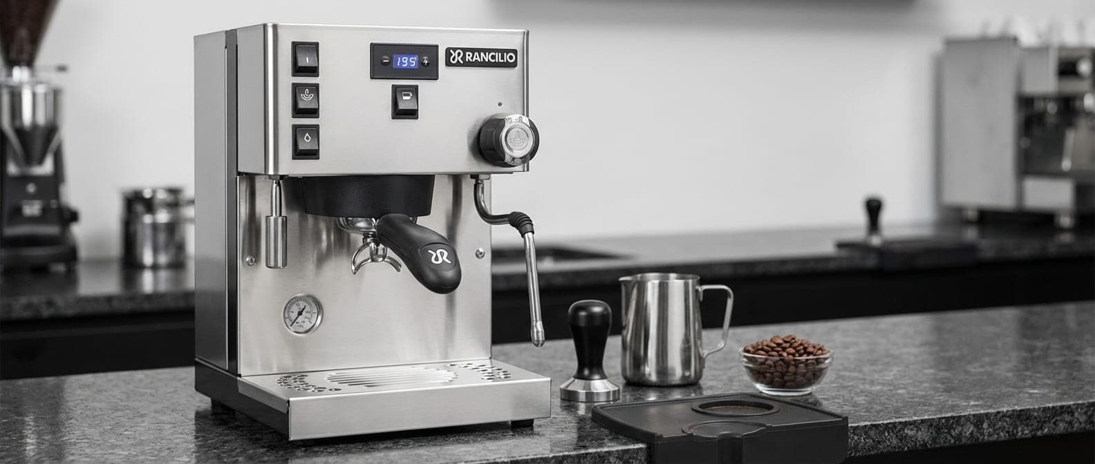 Rancilio Silvia Pro X dual boiler espresso machine with dedicated 300ml brew boiler and 750ml steam boiler for simultaneous extraction and milk texturing, dual PID controllers for precise temperature management, insulated boilers for thermal stability, commercial E61-style group head, powerful steam wand producing dry microfoam perfect for intricate latte art patterns and milk-based specialty drinks from professional barista equipment testing and milk texturing technique training with 200+ baristas