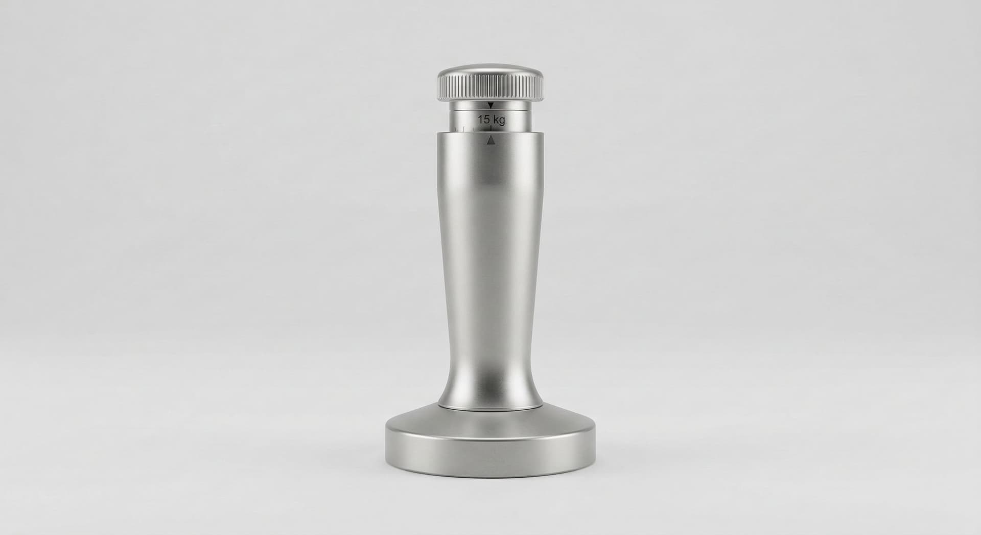 Spring-loaded calibrated espresso tamper with visible pressure mechanism — self-calibrating tamper set to 15 kg for consistent espresso tamping pressure