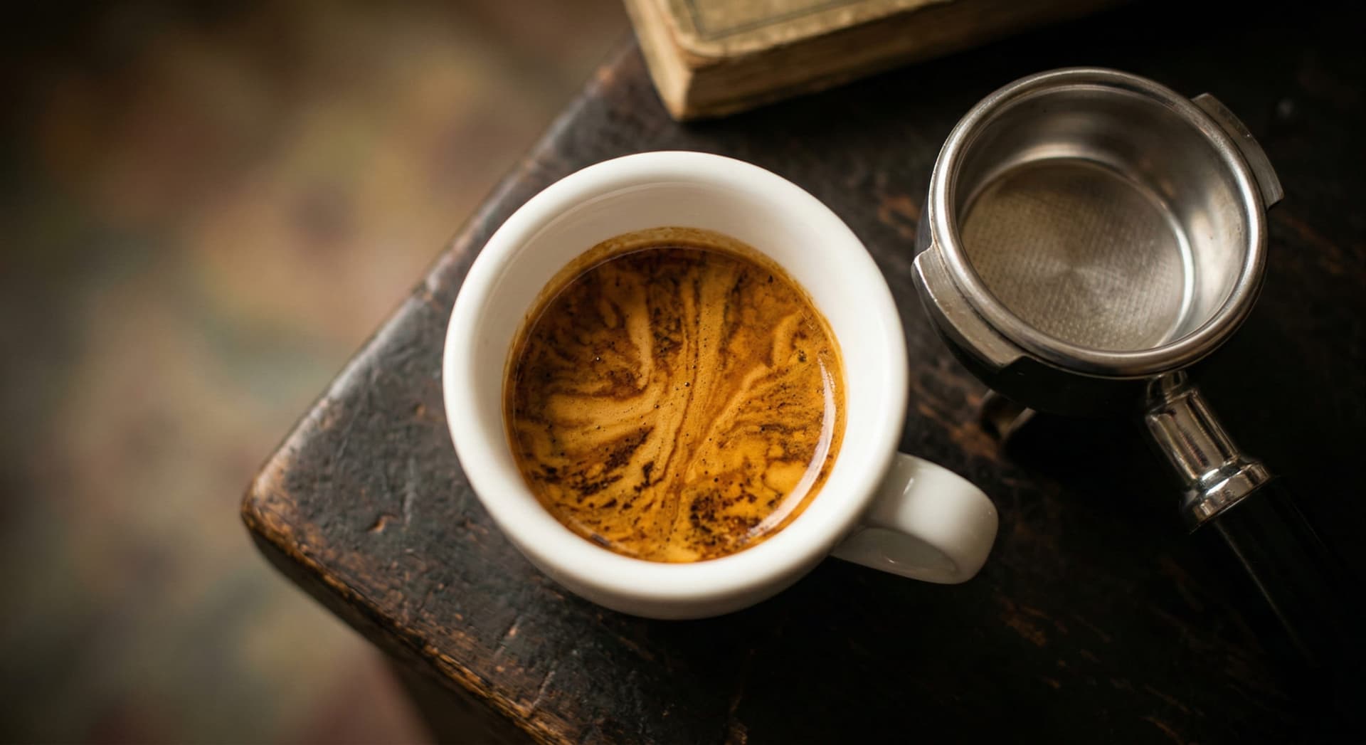 What is a macchiato — espresso macchiato and latte macchiato side by side on a café counter with warm natural lighting