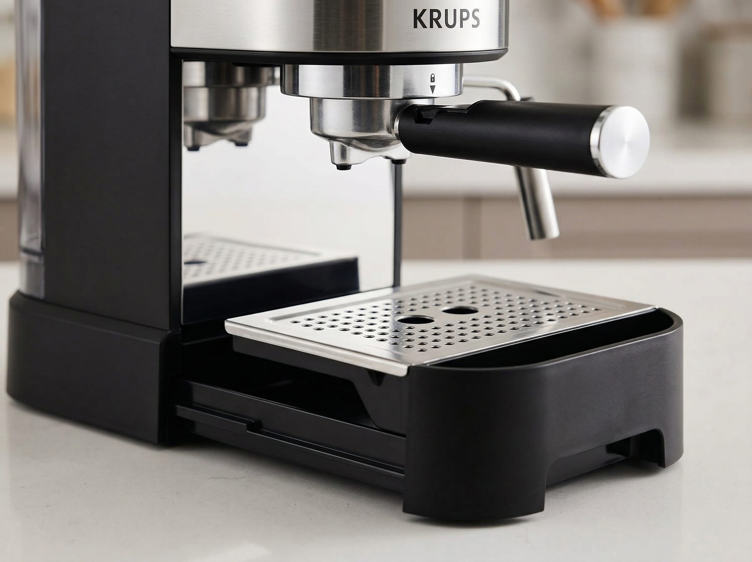 Krups XP444C50 removable drip tray and cup warming plate showing cleanup design for entry-level espresso maker