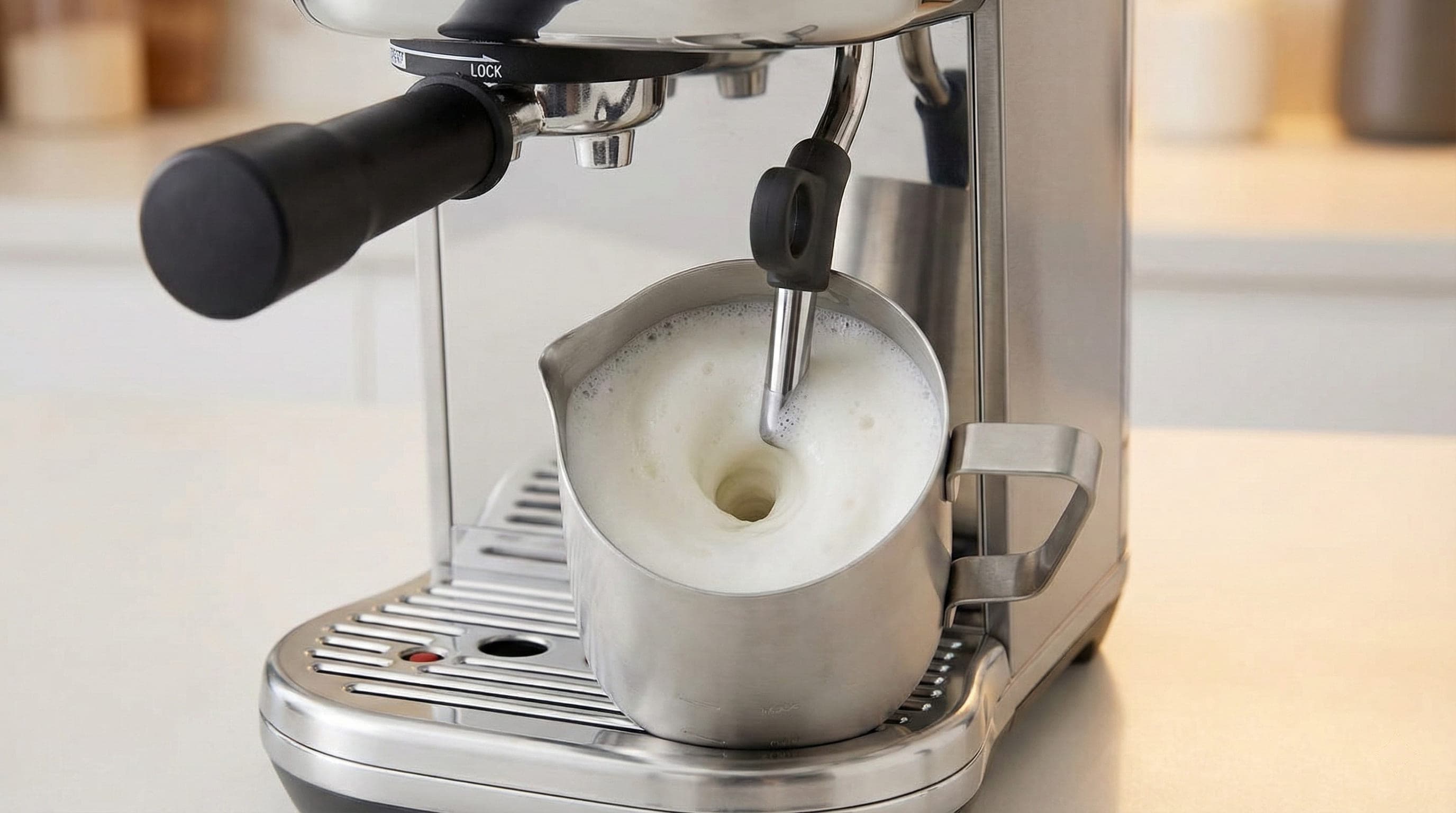Breville Bambino Plus steam wand texturing milk in its stainless steel jug on the drip tray