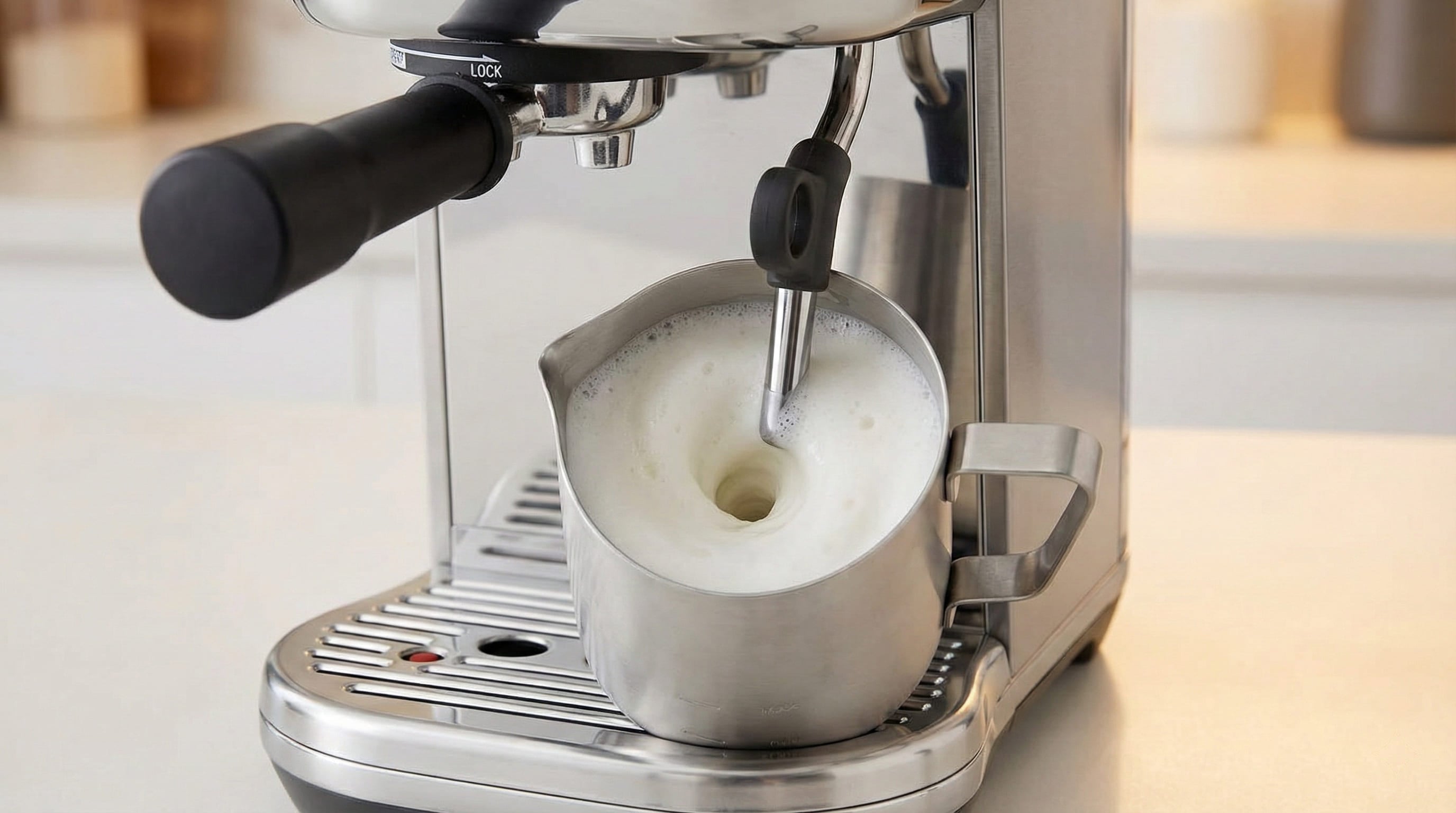 Breville Bambino Plus automatic milk texturing with integrated temperature sensor creating barista-quality microfoam for latte art and cappuccinos
