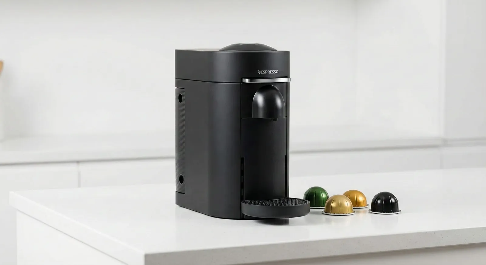Nespresso VertuoPlus pod coffee maker with a Vertuo capsule and coffee mug