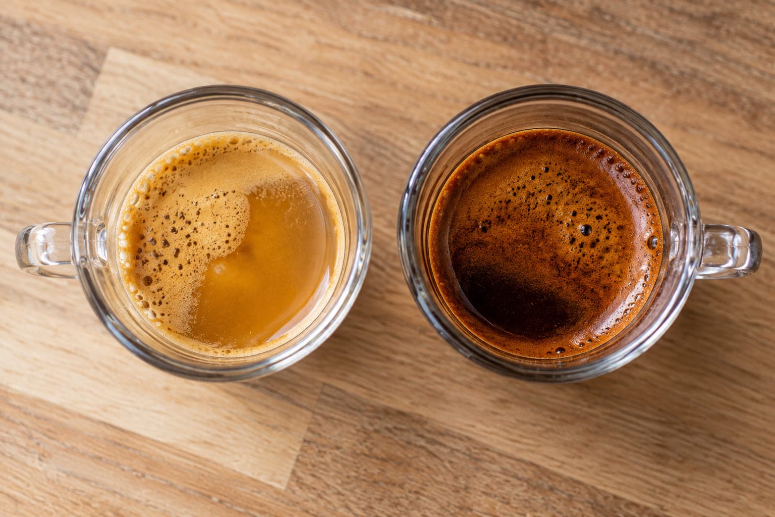 Two espresso shots side by side — a pale, thin, fast-pulled shot and a dark, syrupy, slow-pulled shot
