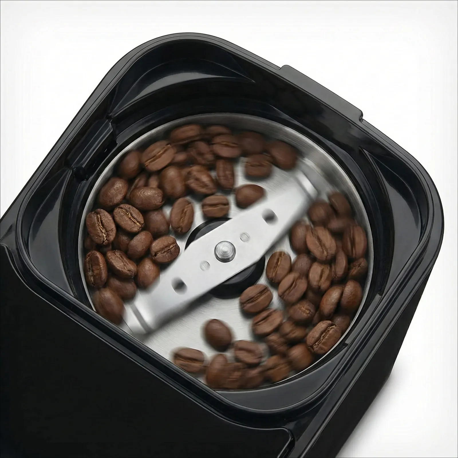 Cuisinart Grind & Brew blade grinder sitting inside the bean hopper compartment