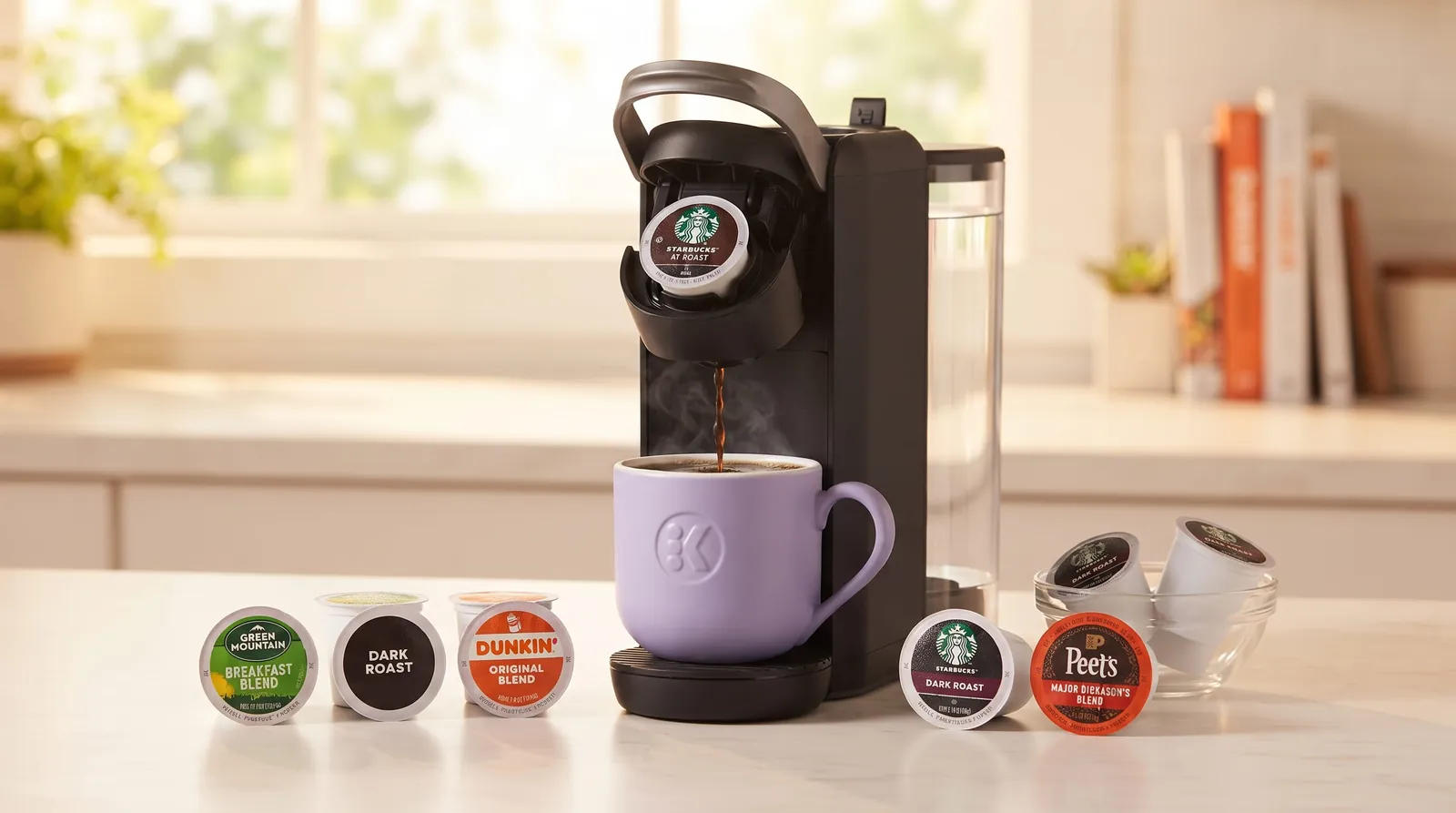 Keurig K-Mini Mate Plus beside an assortment of K-Cup pods from different coffee brands