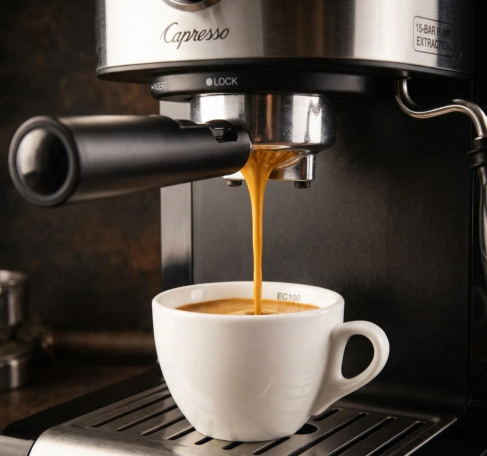Capresso EC100 espresso with crema flowing into a cup during extraction