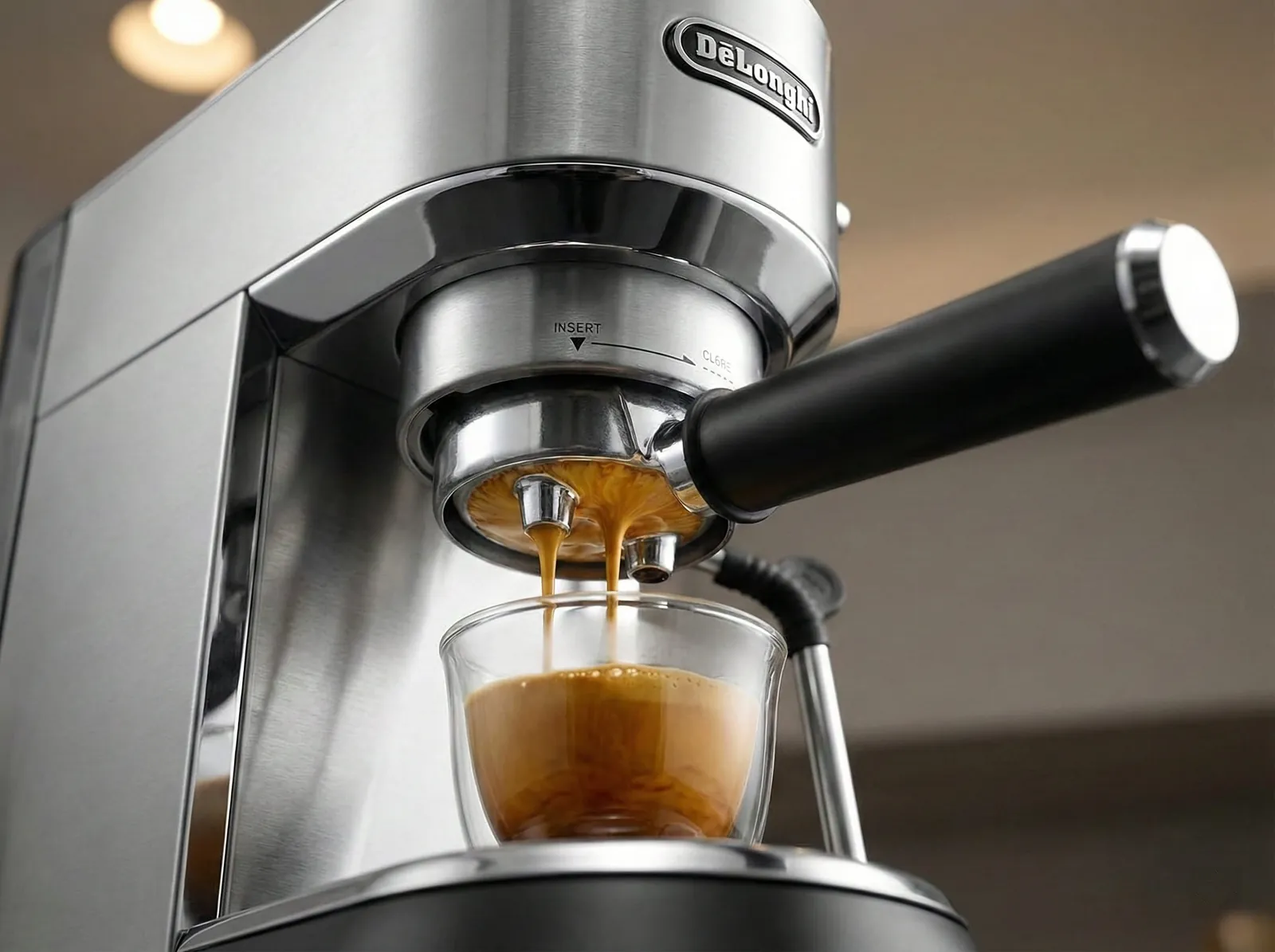 De'Longhi Dedica EC685 51mm portafilter extracting espresso with crema into a cup