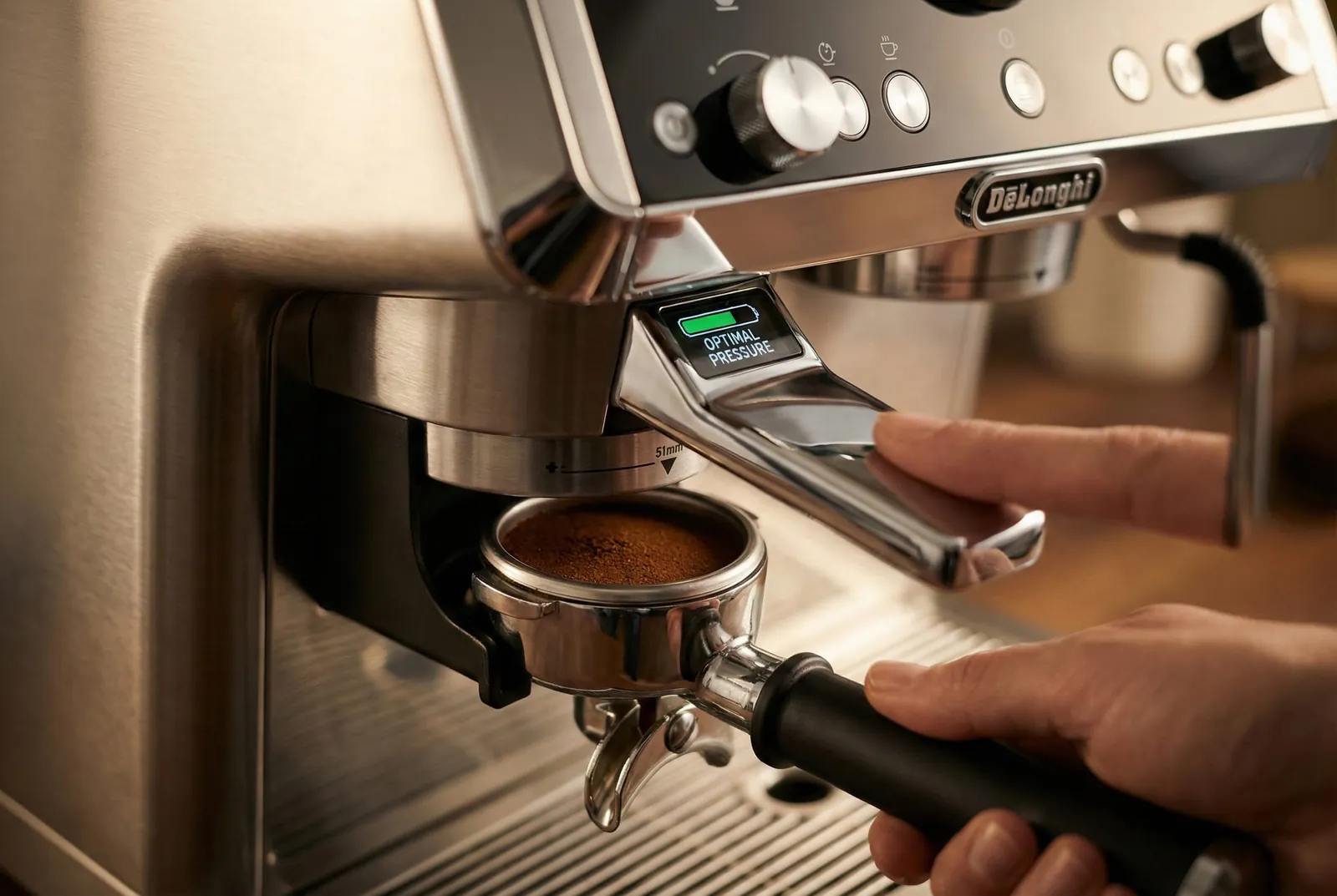 DeLonghi La Specialista Prestigio smart tamping station pressing ground coffee into the portafilter