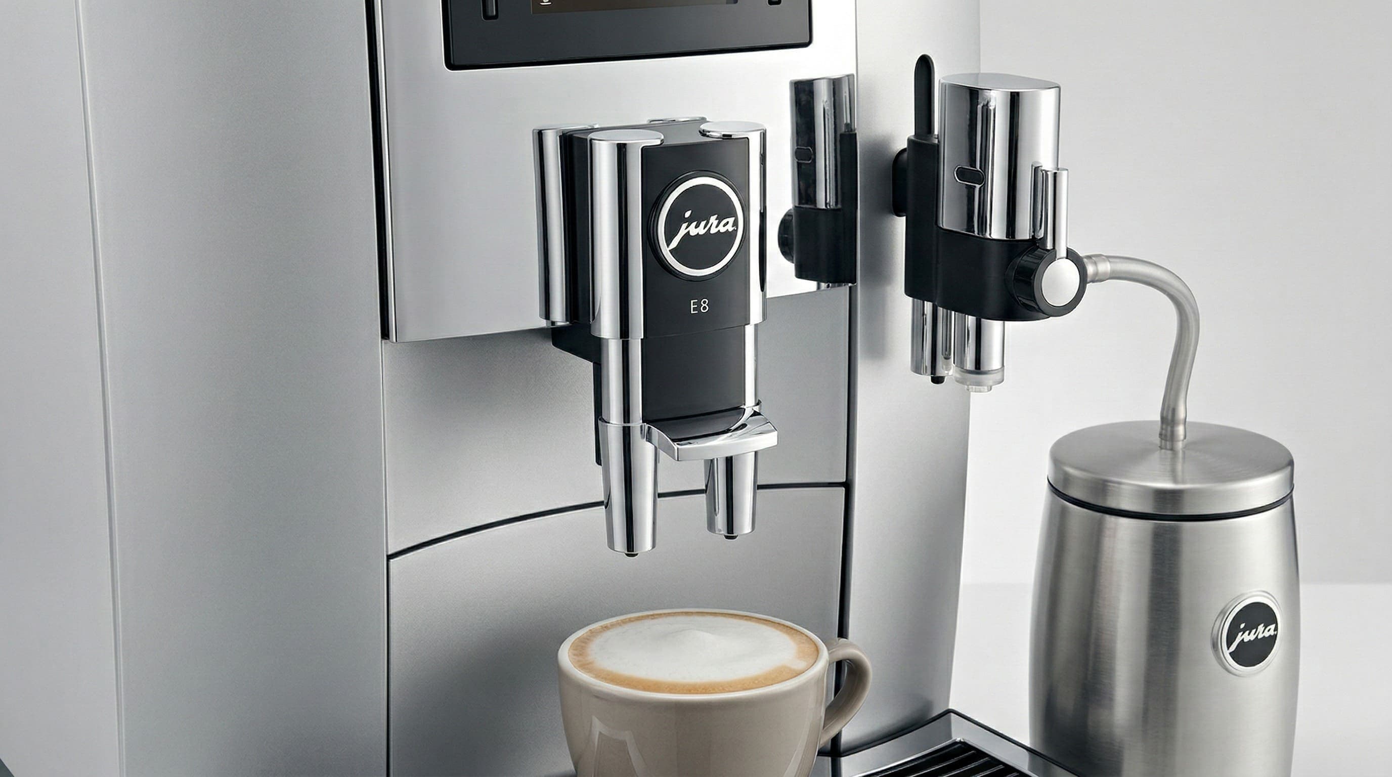 Jura E8 milk system hose connection and fine foam outlet in close-up