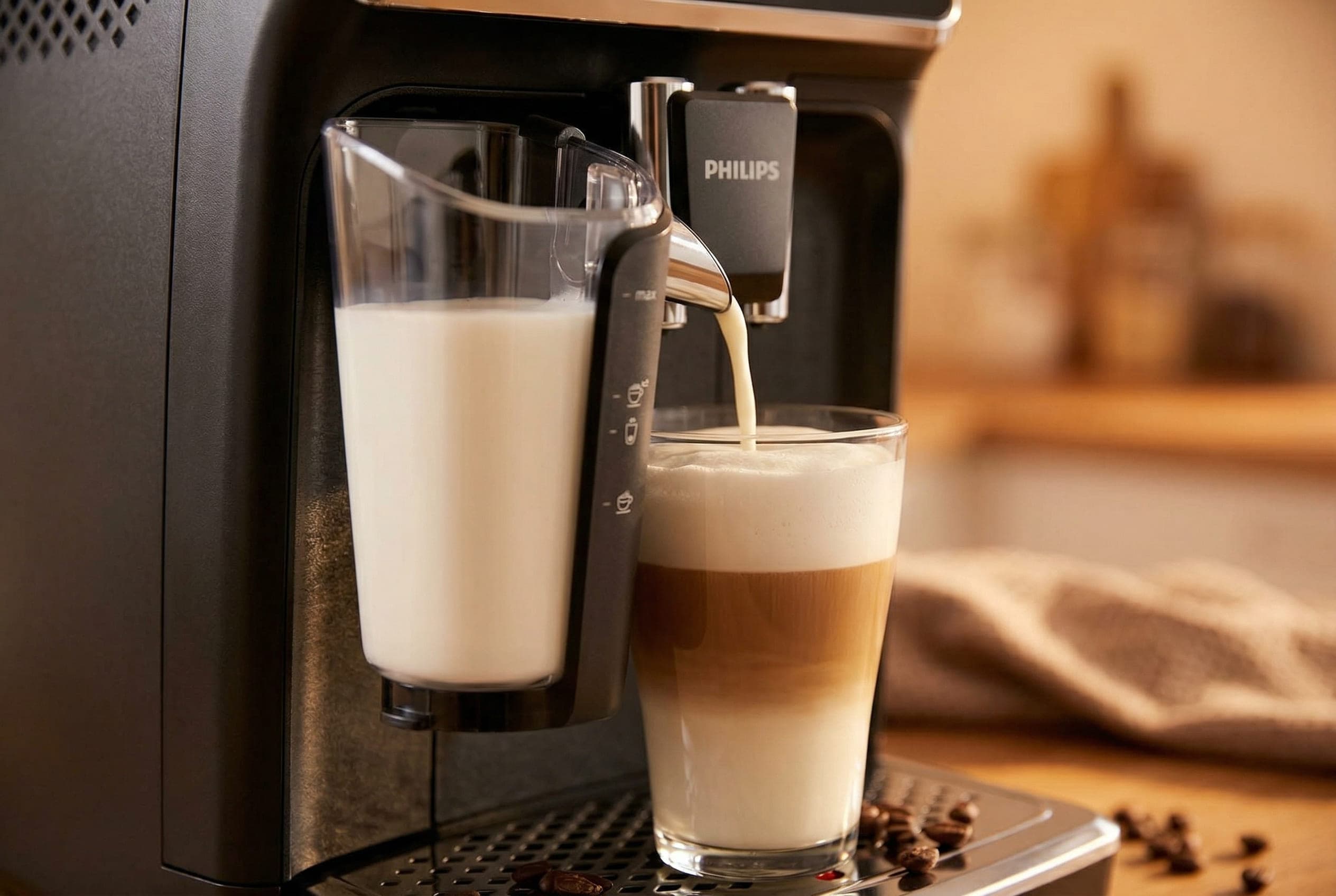 Philips 3200 LatteGo milk system pouring microfoam into a latte glass