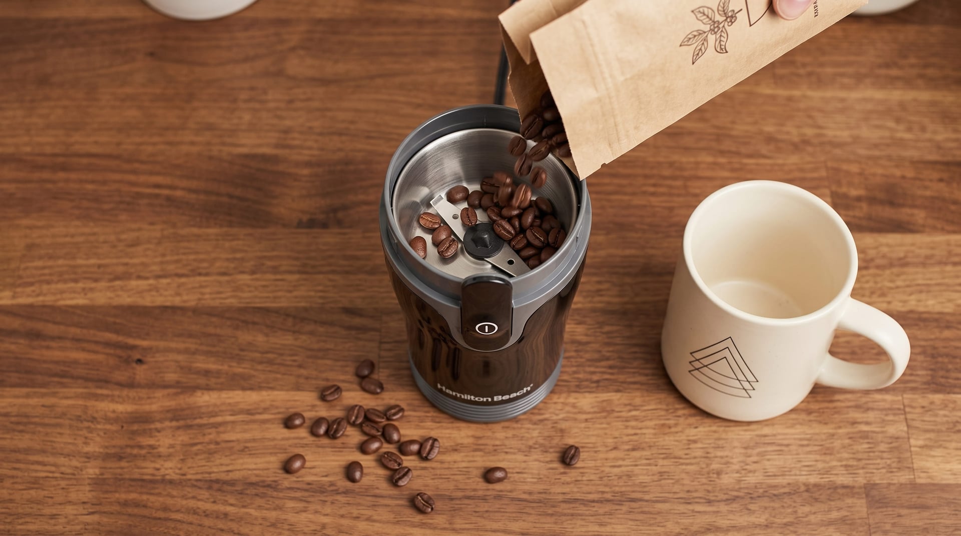 Hamilton Beach Fresh Grind grinder capacity 4 ounce chamber holding whole coffee beans before grinding