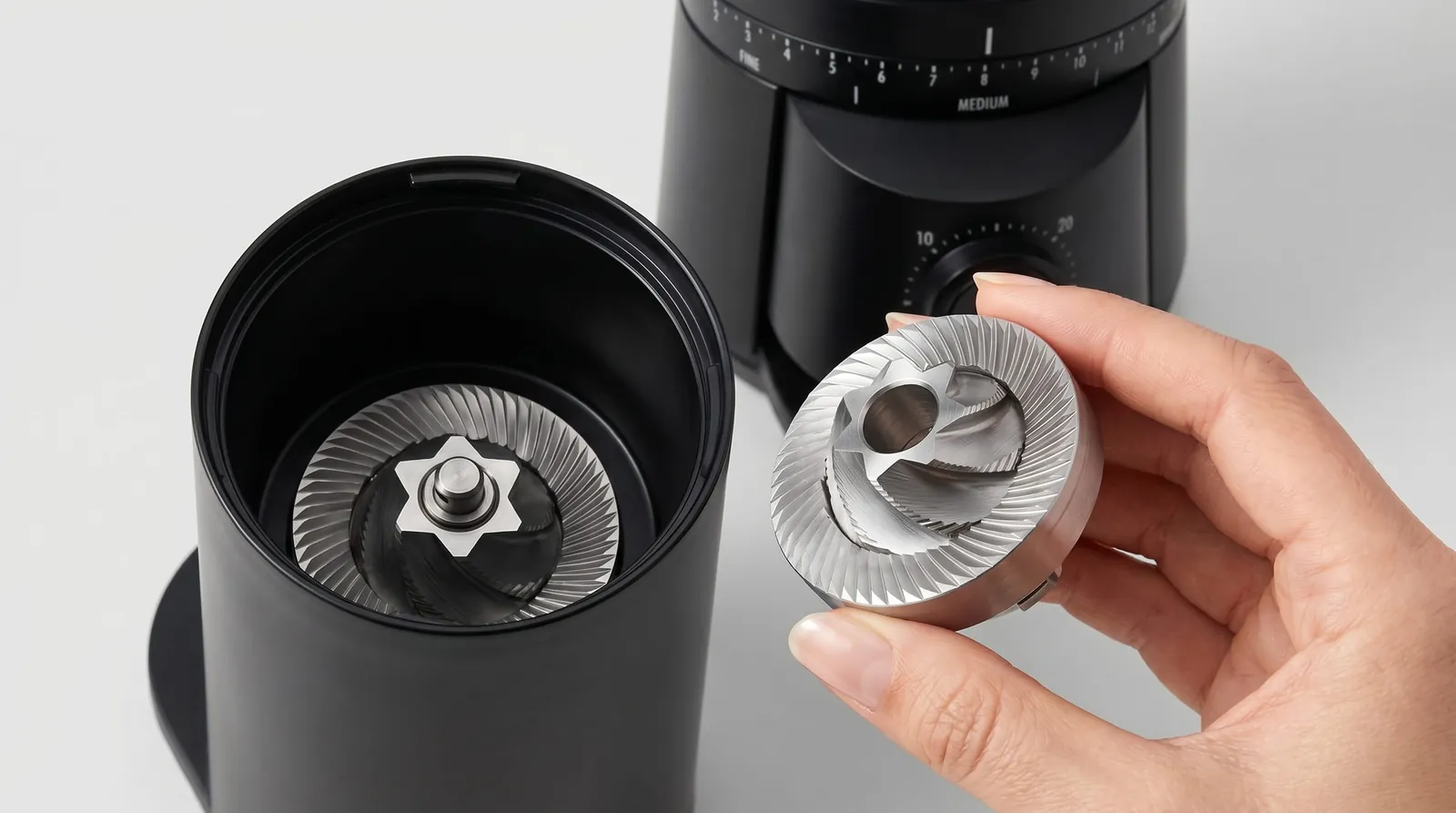OXO Brew Grinder with the upper burr removed to show the stainless steel conical teeth