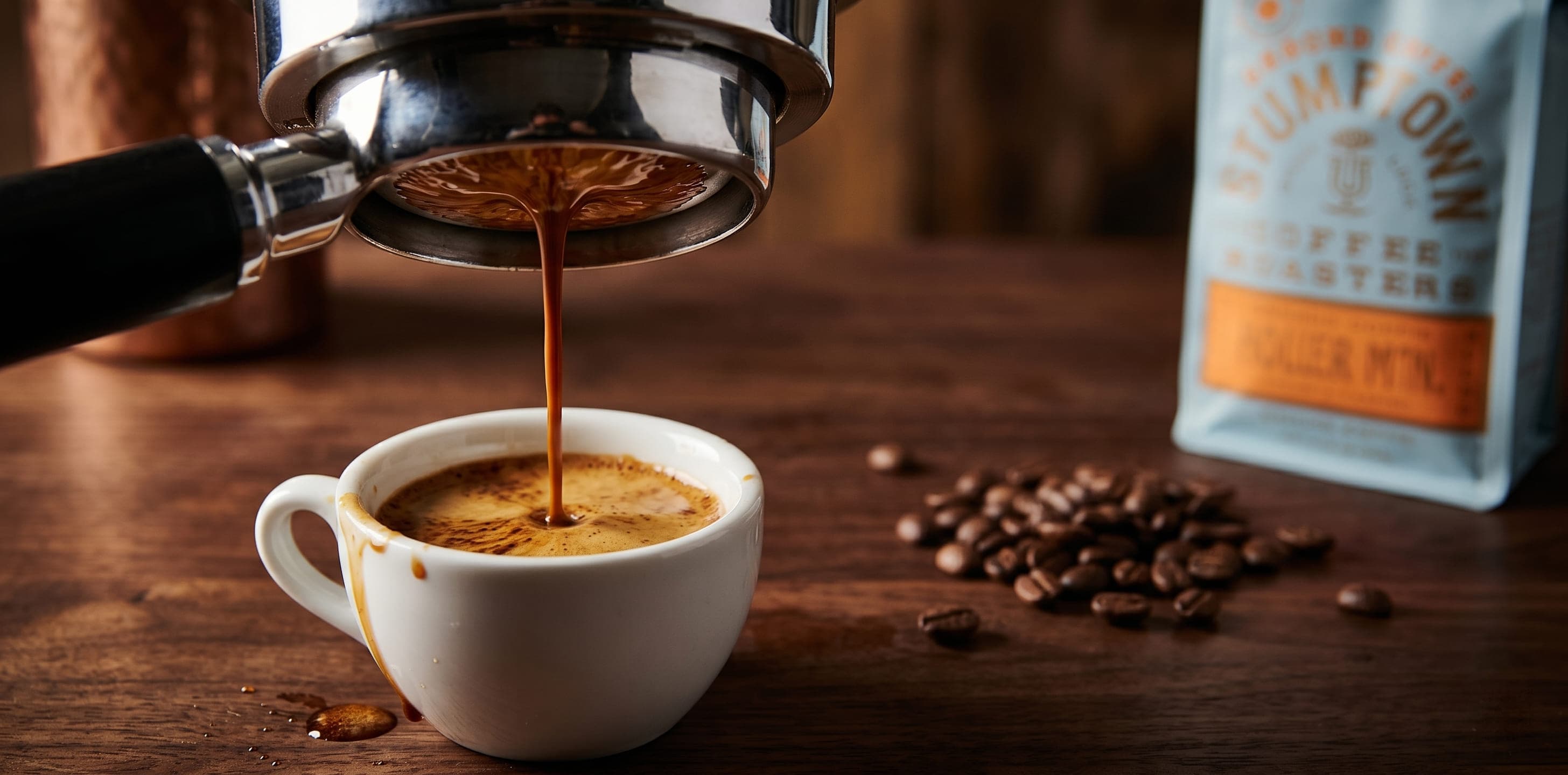 Stumptown Holler Mountain espresso pulled from a bottomless portafilter into a white demitasse