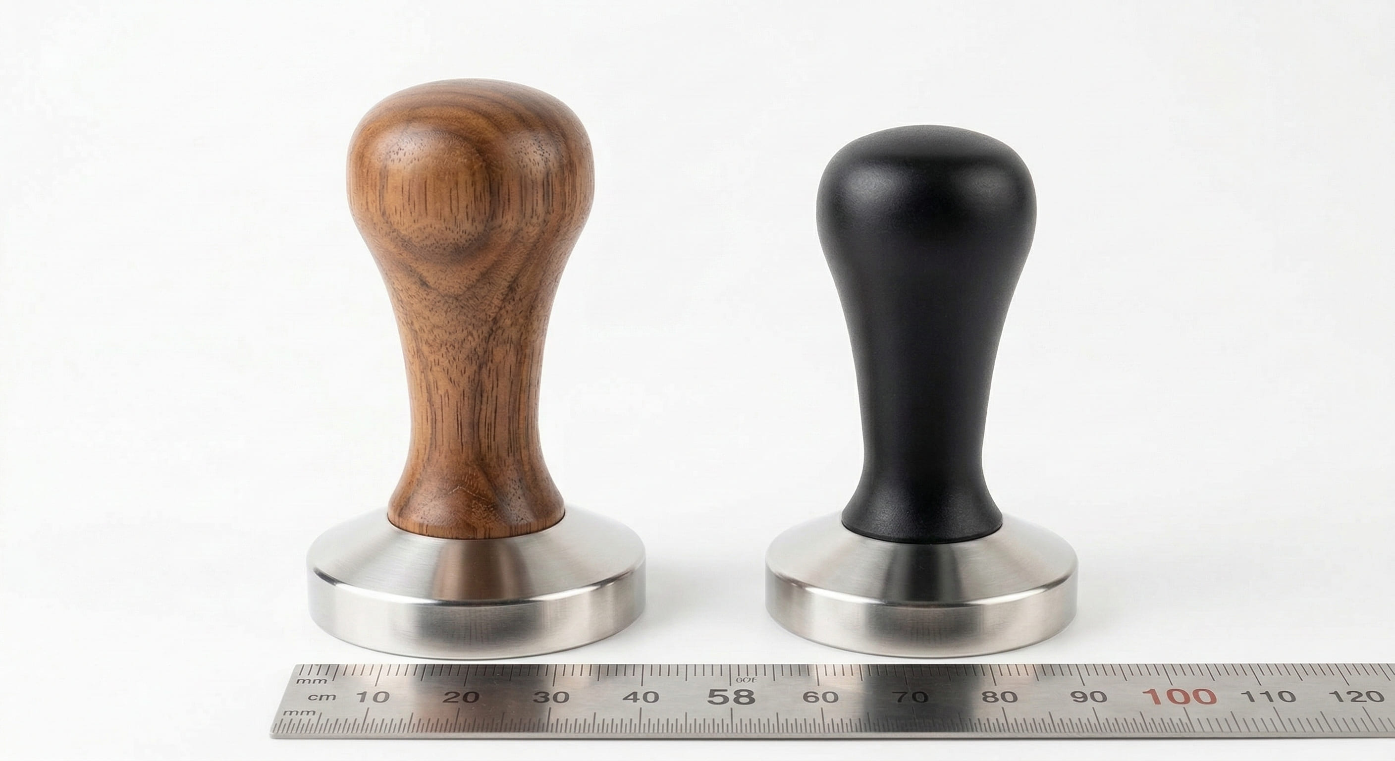 Two espresso tampers side by side showing 58 mm and 53 mm size difference — tamper size comparison for portafilter basket matching
