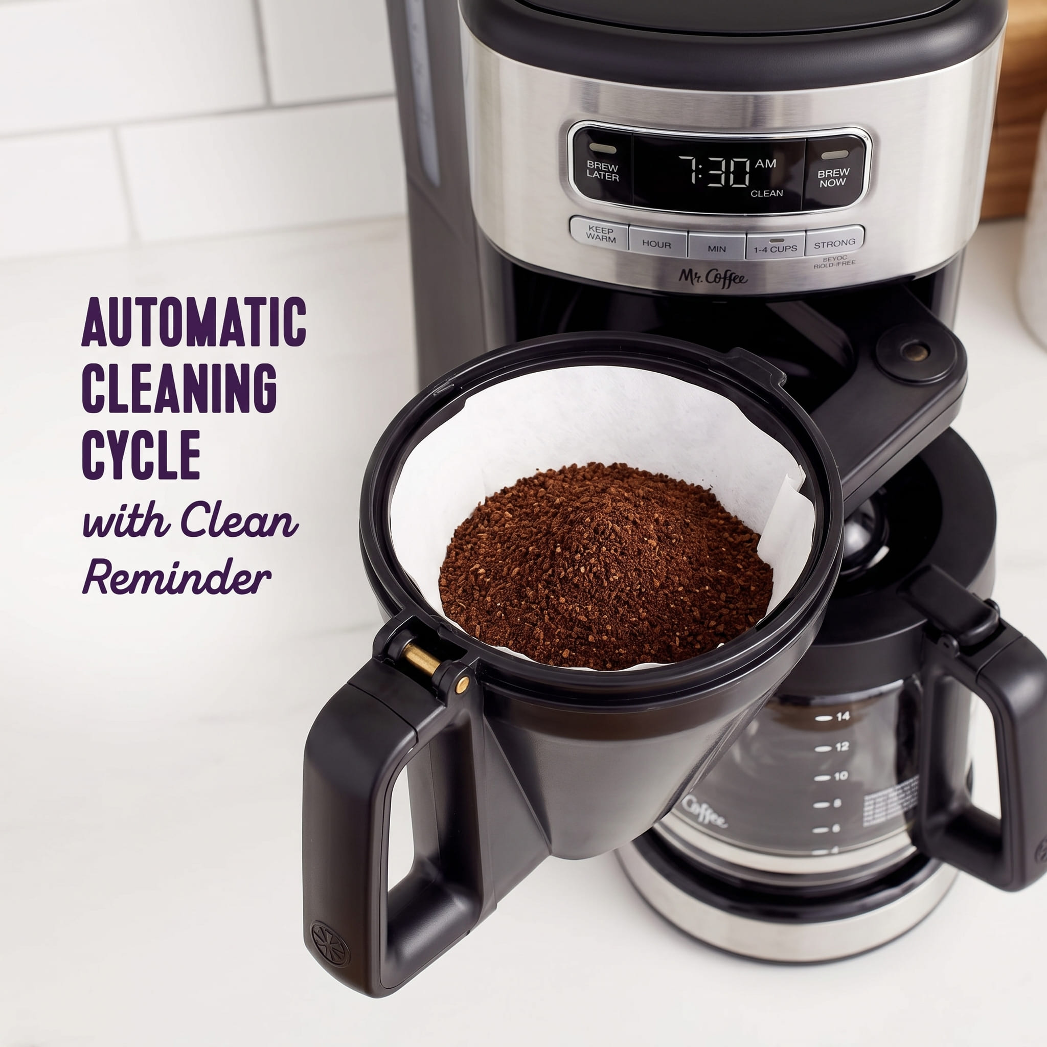 Mr. Coffee 14-cup programmable swing-out filter basket open and loaded with paper filter and ground coffee — ready to brew