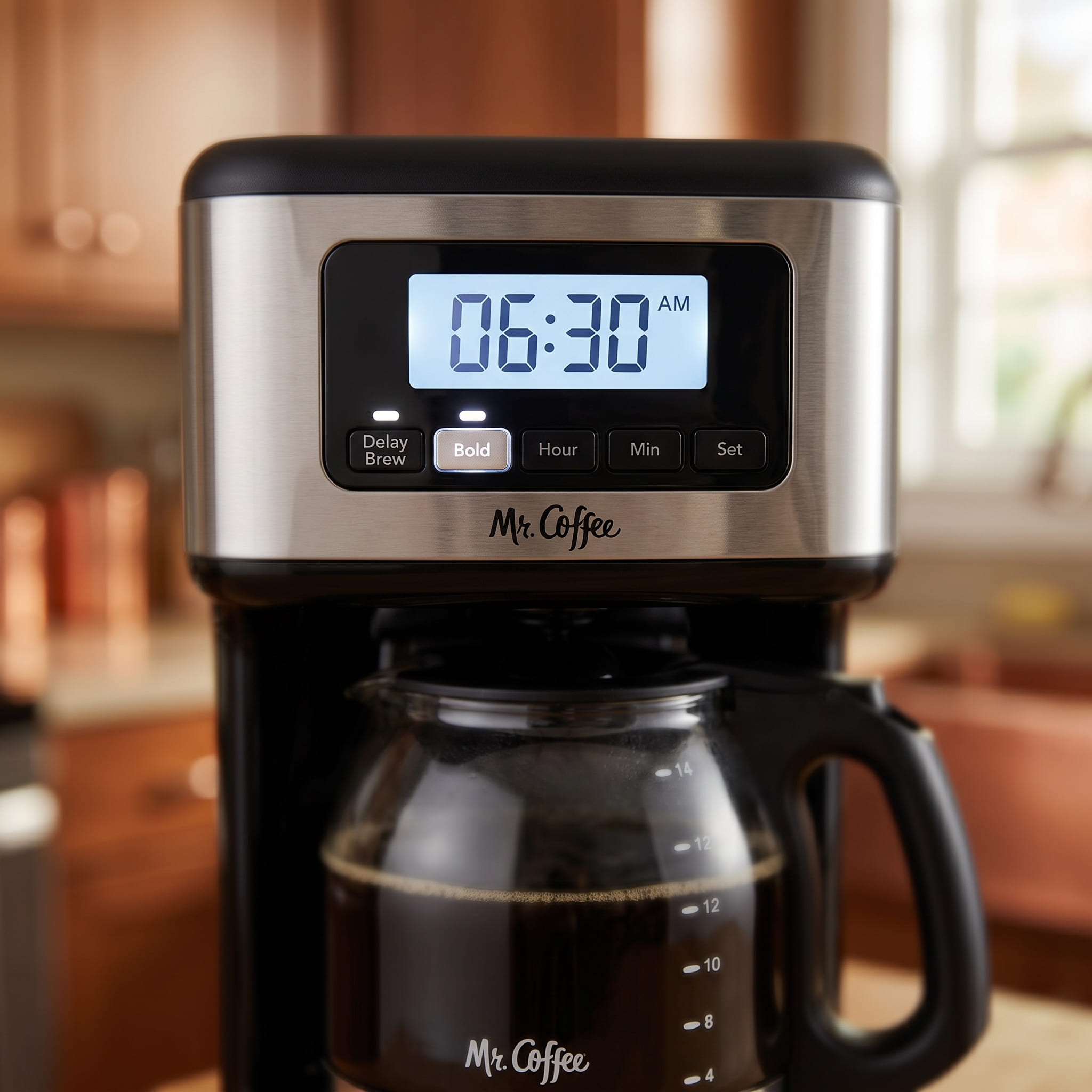 Mr. Coffee 14-cup programmable LCD control panel close-up — showing 24-hour digital clock, delay brew timer, and brew strength selector buttons