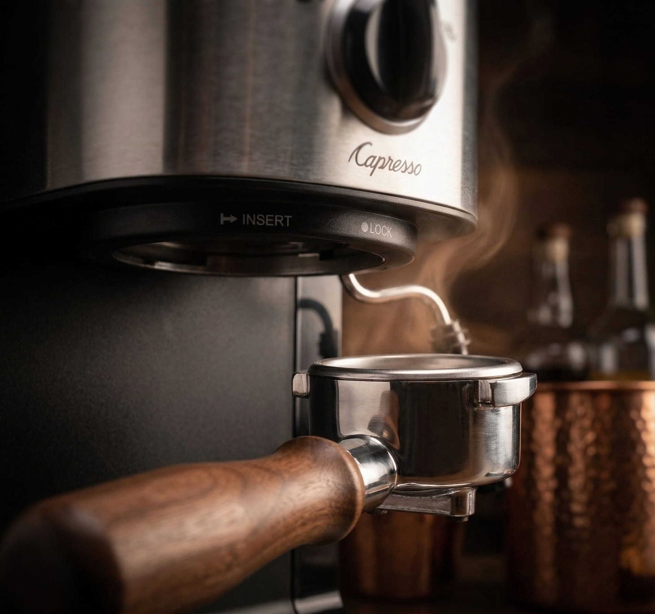 Capresso EC100 commercial-style portafilter locked into group head — espresso extraction detail capresso espresso machine review