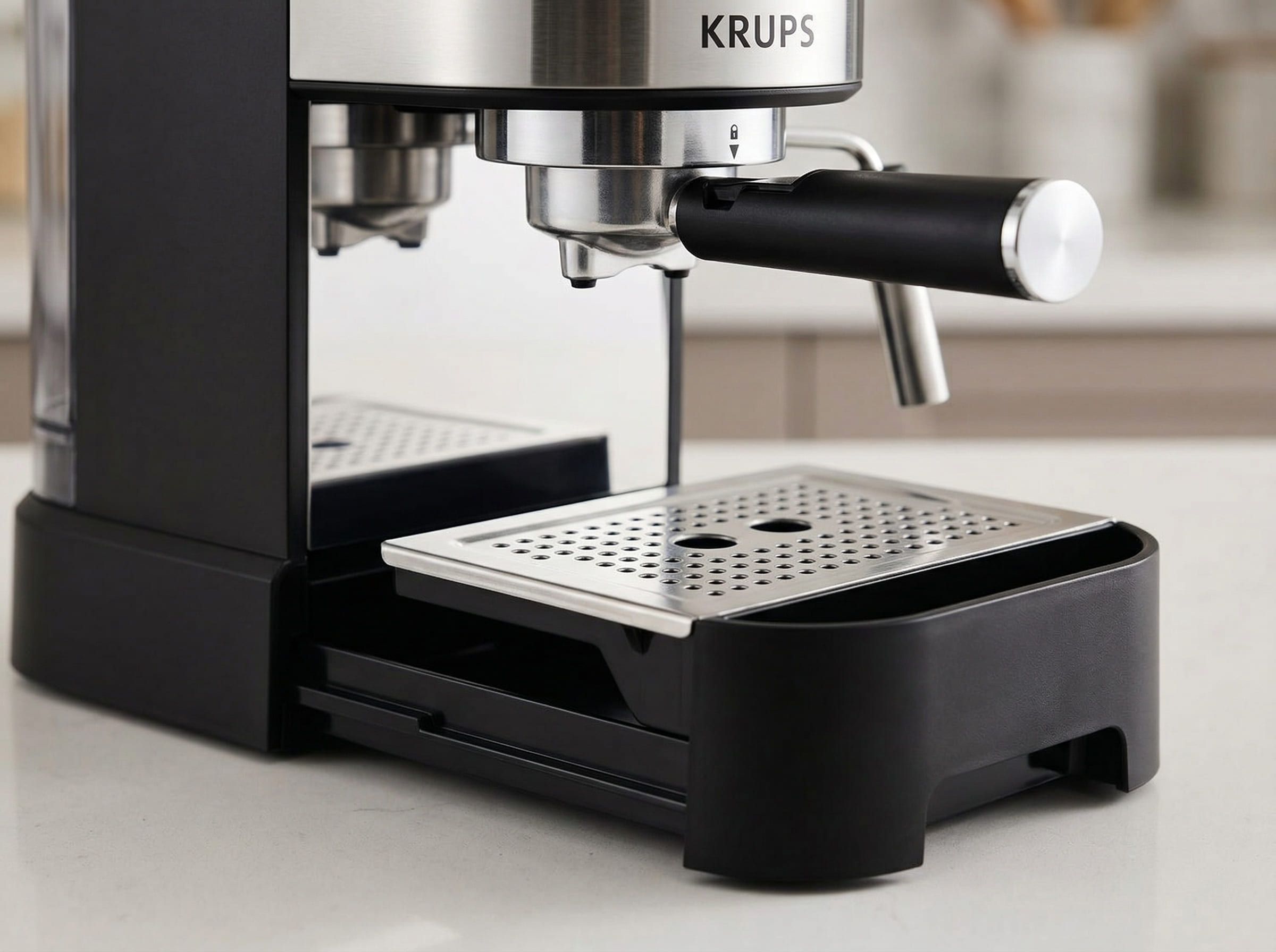 Krups XP444C50 removable drip tray and cup warming plate showing cleanup design for entry-level espresso maker